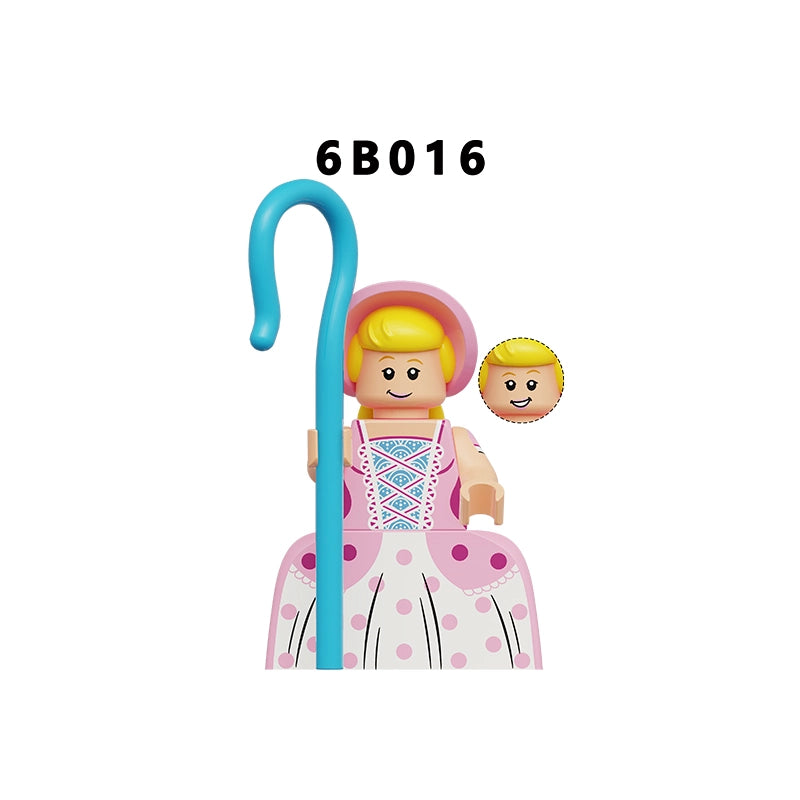 A toy minifigure with blonde hair, wearing a pink dress and hat, holding a blue staff, shown on a plain white background with the text '6B016' above and a small circular inset of the blonde head above the dress.