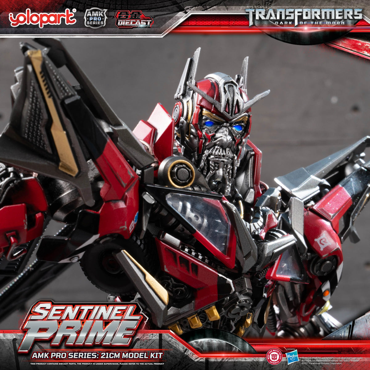 A cinematic close-up profile portrait focusing on the head and torso of the AMK PRO Sentinel Prime figure. The blue LED illumination within the eyes is brightly lit, casting a glow over the finely sculpted, bearded face plating. The metallic red finish displays realistic paint chipping and mechanical gradients across the shoulders and chest paneling.