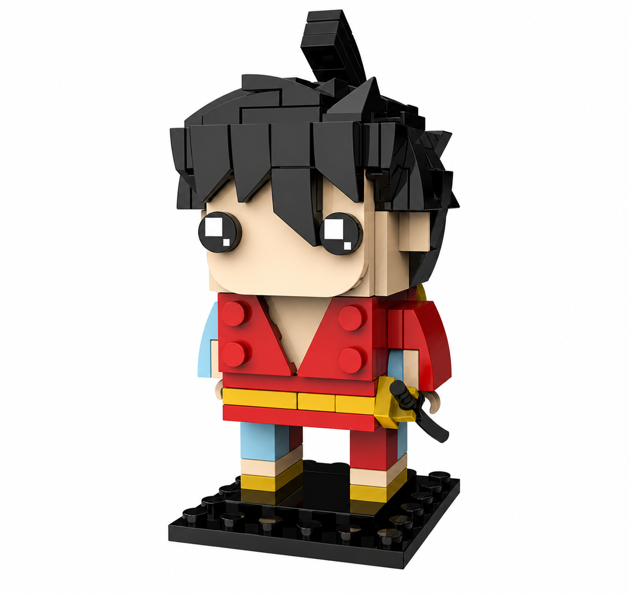 A block-built toy figure of a cartoon character with black spiky hair, large white eyes, a red top, yellow waist detail, light blue sleeves, and red-and-yellow pants, standing on a black base against a white background.