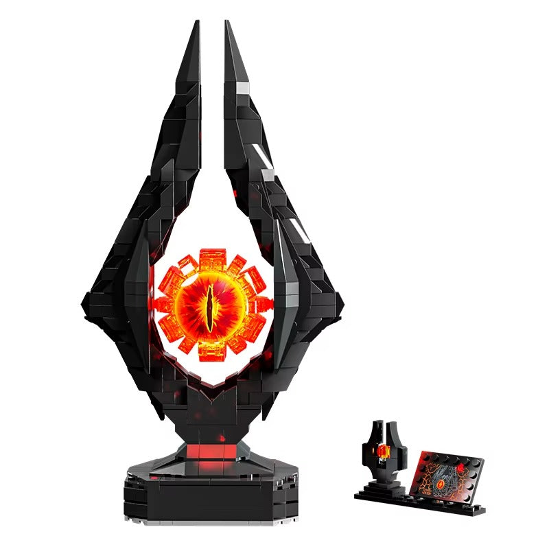 Black and red futuristic device with glowing eye-like center on a white background